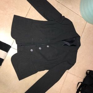Grey woman’s business formal jacket and pants